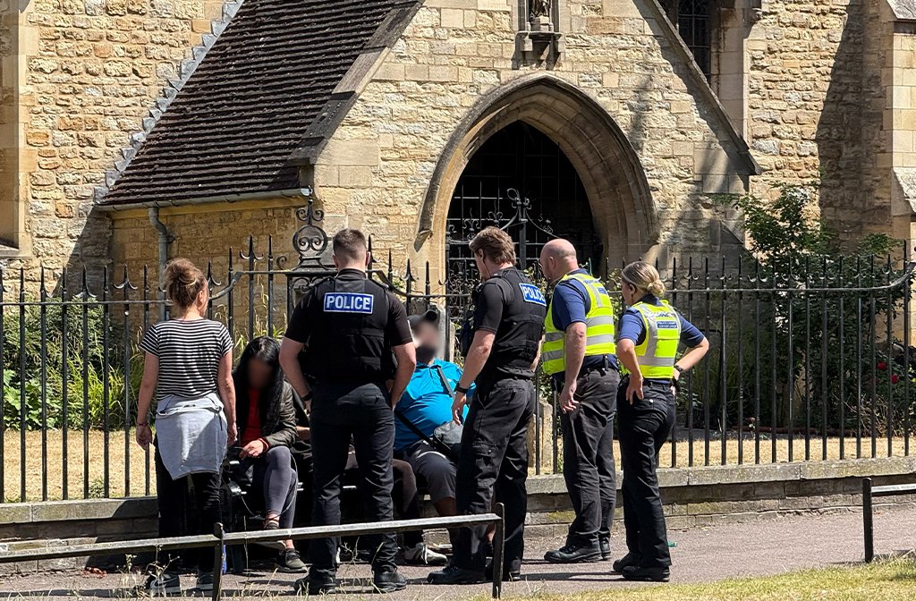 Bedfordshire Police officers speaking with people congregating on St Peter's Green in Bedford Image Bedford Independent