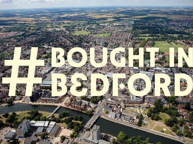 Aerial photo of Bedford town centre with the words #BoughtInBedford