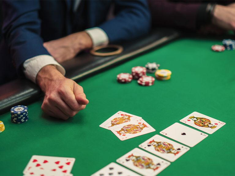 Close up on winner's cards revealing two kings at a poker game. Image: Kitreel Shutterstock