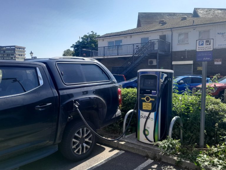 Photo of an SUV plugged into an electric car charging point outside Star Rowing Club