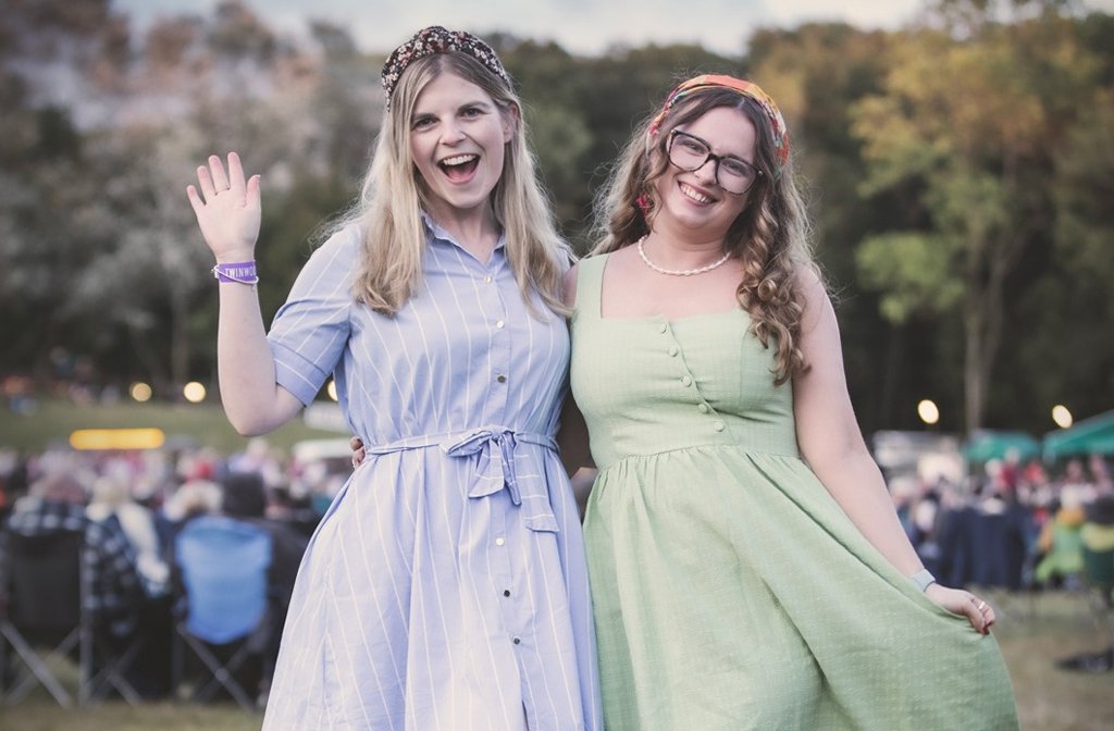 Two festival-goers in vintage attire at Twinwoods