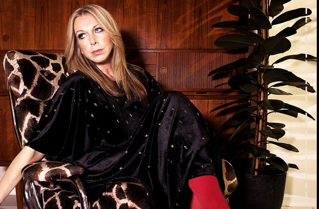 Singer Jane Weaver is pictured sitting in an animal print chair