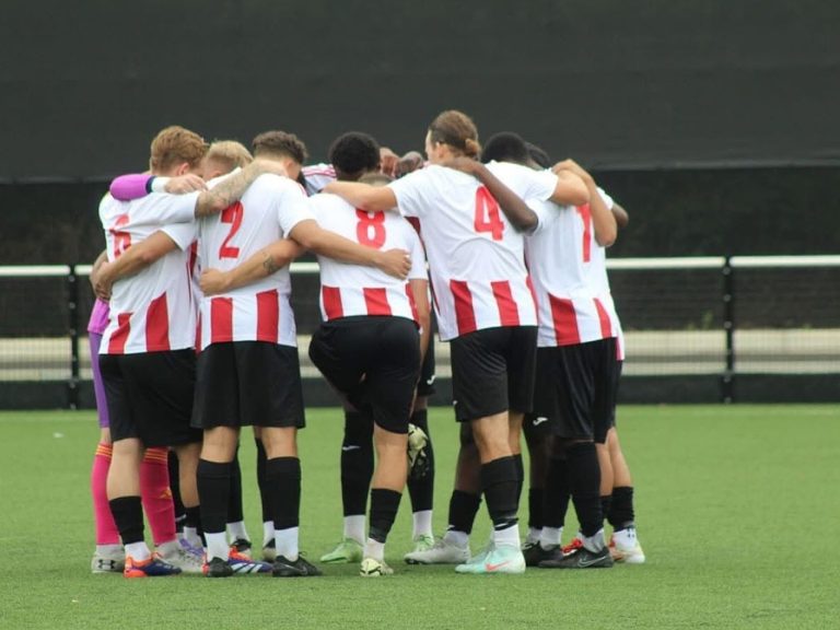 Group huddle for Kempston Rovers before a pre-season friendly in July 2025