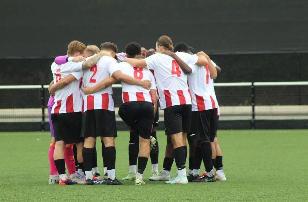 Group huddle for Kempston Rovers before a pre-season friendly in July 2025