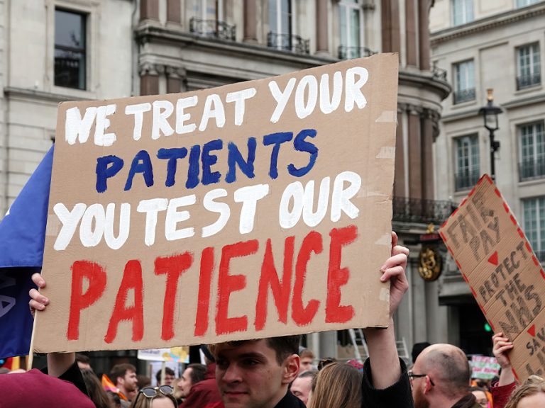Resident (formerly Junior) doctors on strike taking part in a protest march in Trafalgar Square in March 2023 to demand higher pay from the government. Image: Nigel J. Harris/Shutterstock