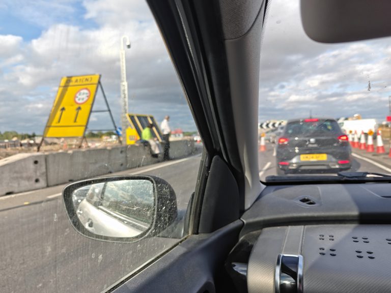 Motorists stuck in the Black Cat Roundabout chaos on 5 July said there were no signs on the A421 indicating the A1 northbound was closed. The picture shows the view from a passenger seat of a car of cars in the jam and a road sign showing no details of any closures. Image: Helen Wheatley
