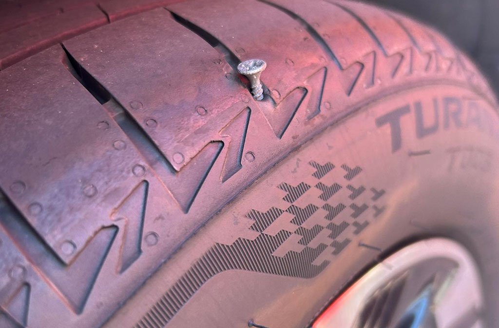 A tyre punctured by one of the discarded screws. Image: Clapham resident