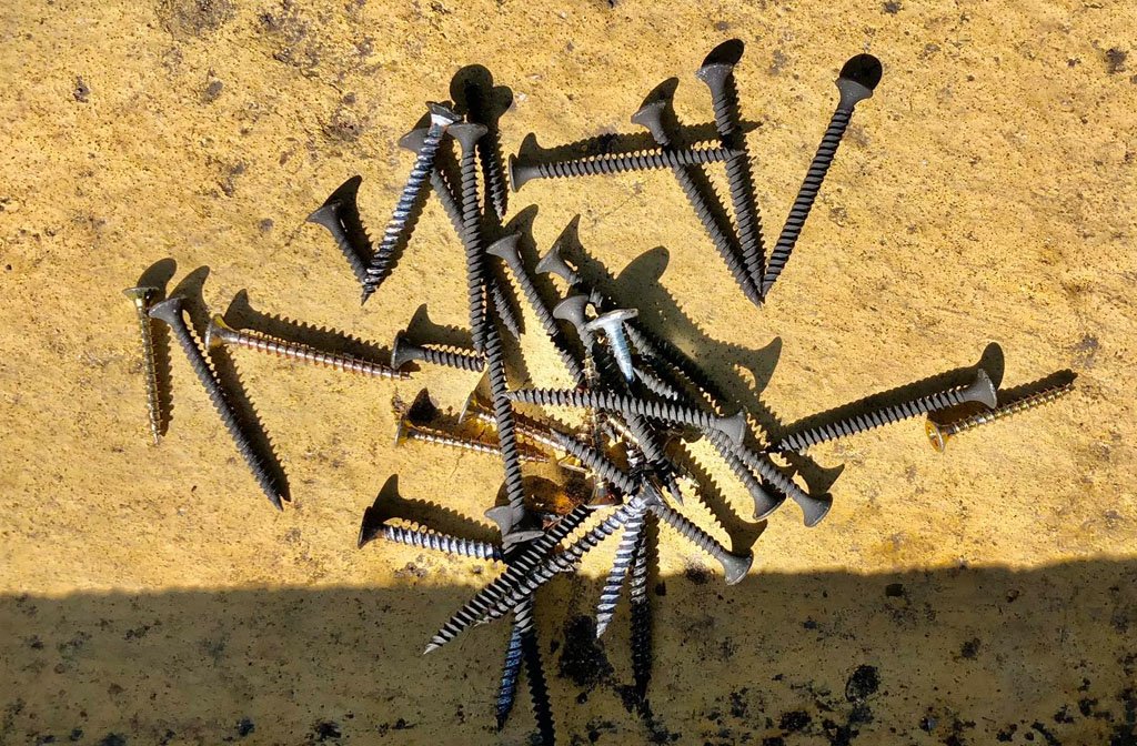 Discarded screws on the roadside