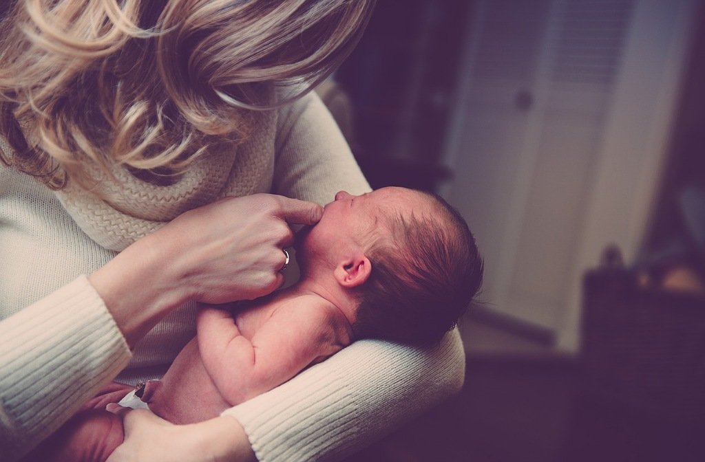 stock image of mother with new born baby
