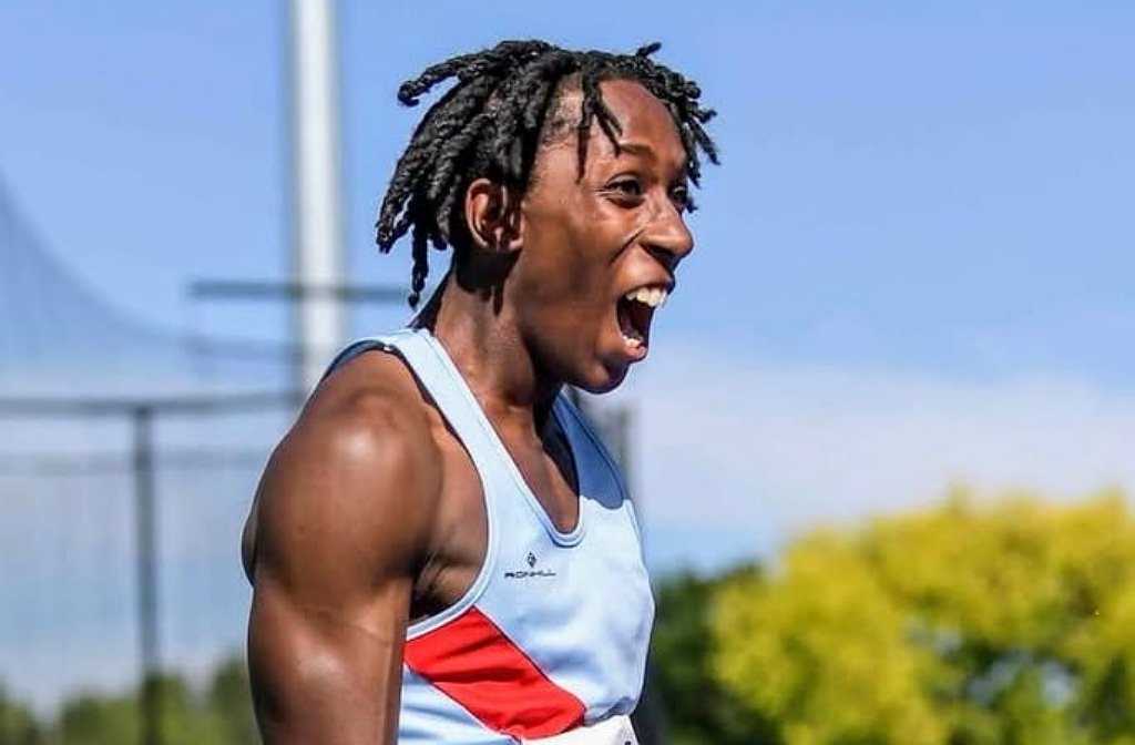 Close up image of Bedfordshire young athletes captain, Zaphaniah Bryan celebrating a bronze medal at the English Schools Centenary Championships