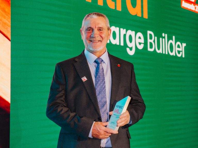 Alan Holmes collecting his National House Building Council’s Pride in the Job Award 2025 Image- Bellway