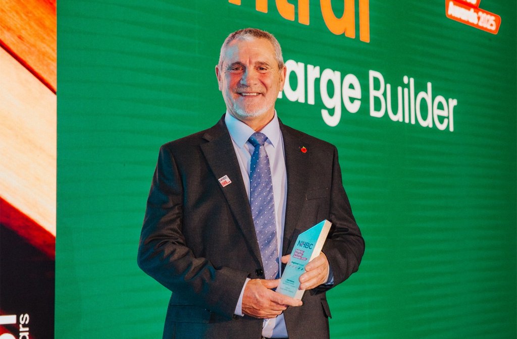Alan Holmes collecting his National House Building Council’s Pride in the Job Award 2025 Image- Bellway