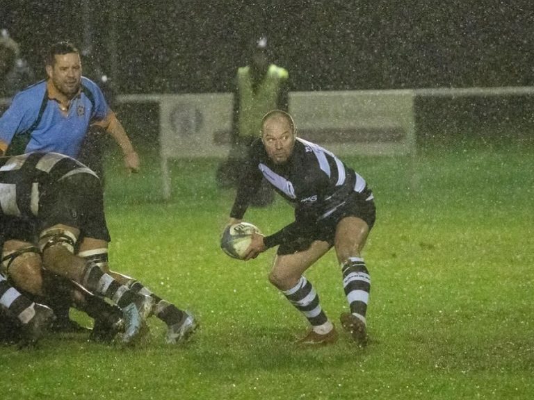 Bedford Athletic scrum half passes in a game against Wellingborough in December 2025