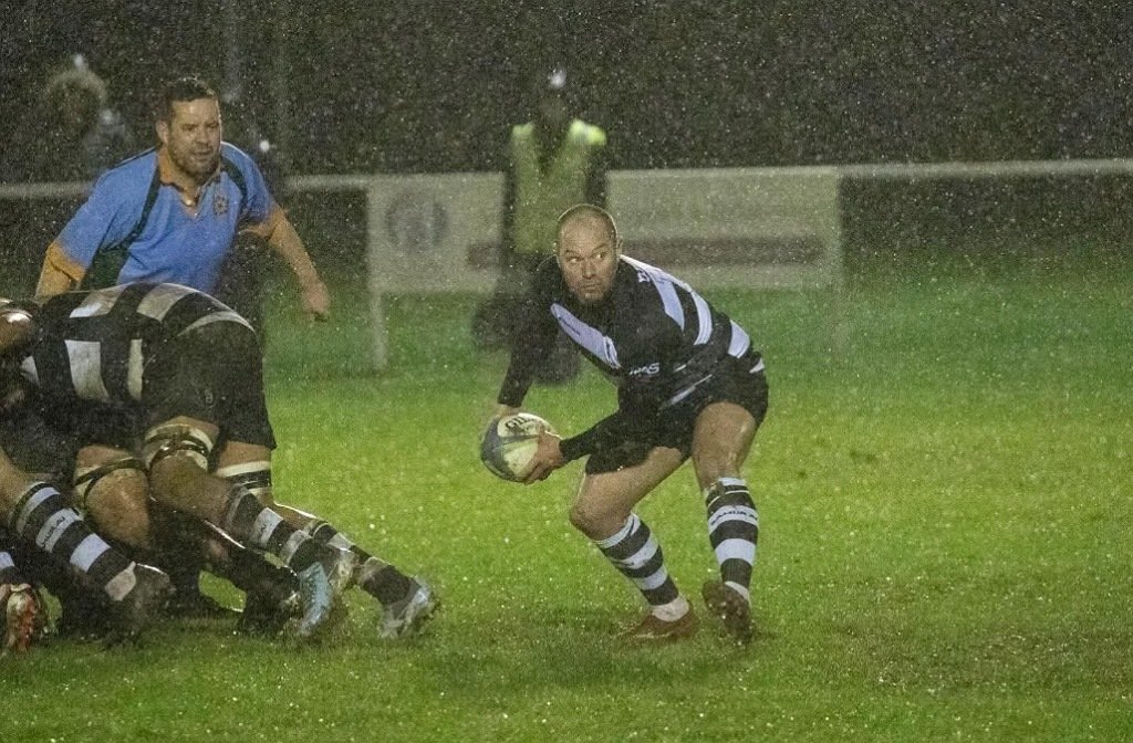 Bedford Athletic scrum half passes in a game against Wellingborough in December 2025