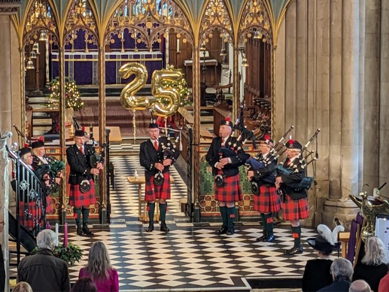 Bedford Pipe & Drum Band opening the 25th Bedford Christmas Tree Festival at St Paul's Church. Image: Bedford Christmas Tree Festival Committee
