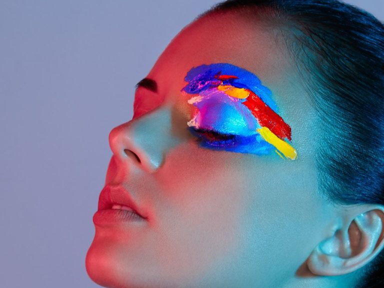 The image from the poster of Bedford Sinfonia's 'all women' concert. The image is of a close up of a woman's face with dramatic eye shadow.