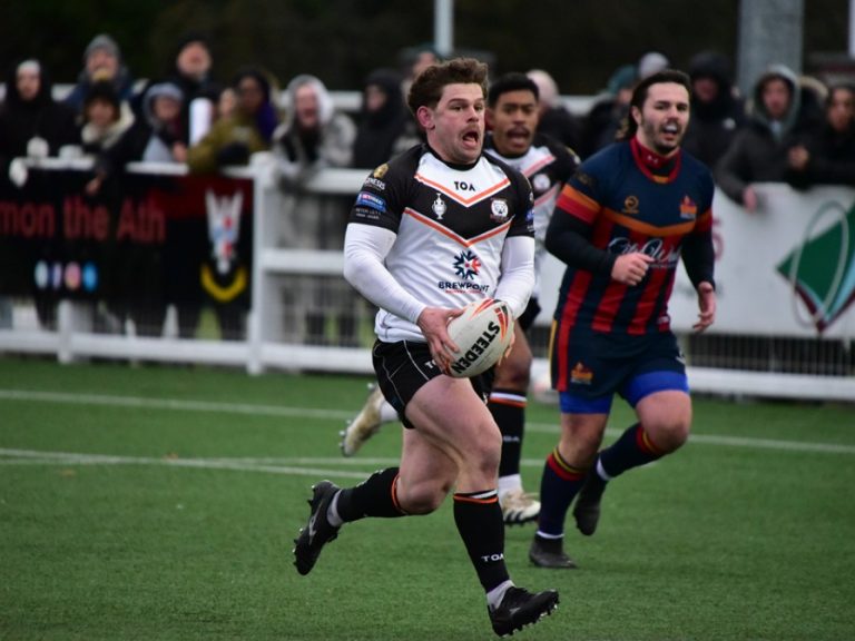Bedford Tigers player races away from Medway Dragons player in their Challenge Cup tie in January 2026