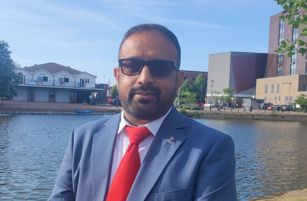 Cllr Abu Sultan pictured alongside the River Great Ouse in Bedford.