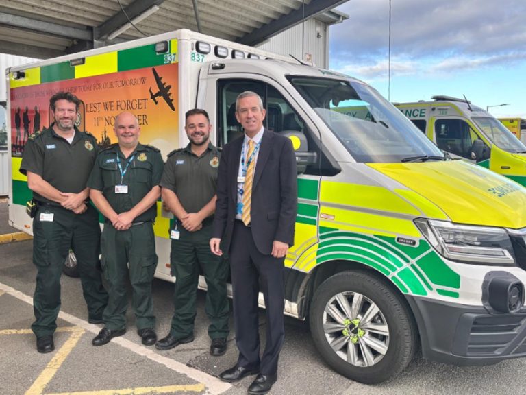 EEAST CEO Neill Moloney in front of a Remembrance Ambulance at Longwater Ambulance Station, with (L-R) Kyle Hampshire-Smith, Head of Clinical Operations for Norfolk and Waveney; Nick Smith, Local Area Manager for Central Norfolk; and Lewis Smith, Deputy Local Area Manager.