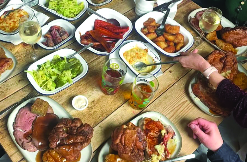 A roast dinner with all the trimmings on the table at Herd