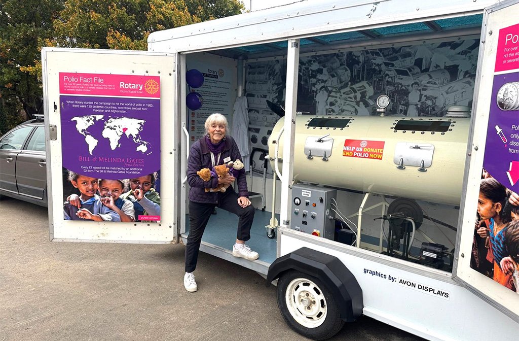 Jan Long of The Rotary Club of Middle England an the Iron Lung touring Bedford to mark World Polio Day. Image: Rotary Club of Middle England