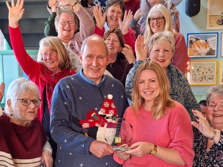 Lemon & Ginger - Knit, Crochet, Sew are presented with their Adult Tree Trophy by Nick Kier of Lane & Holmes Estate Agents surrounded by members of the Christmas Tree Festival Committee. Image: Bedford Christmas Tree Festival