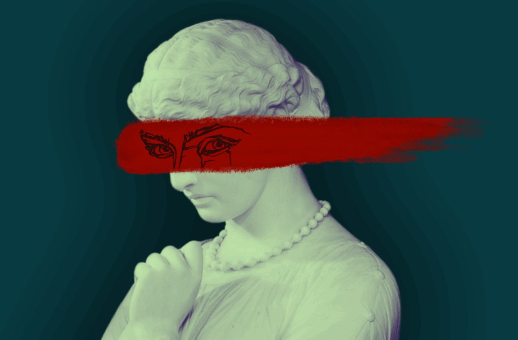 A picture of a marble statue of a woman with a red smear of paint across her face and malevolent eyes drawn on the paint