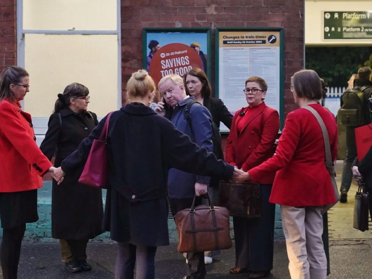 Protesters from the Citizen's Arrest Network surround Anglian Water CEO Mark Thurston at a London Train Station 15 October 2025. Image: Citizen's Arrest Network