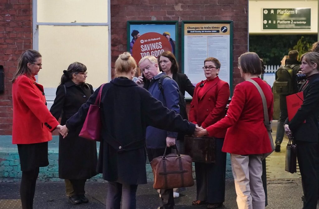 Protesters from the Citizen's Arrest Network surround Anglian Water CEO Mark Thurston at a London Train Station 15 October 2025. Image: Citizen's Arrest Network