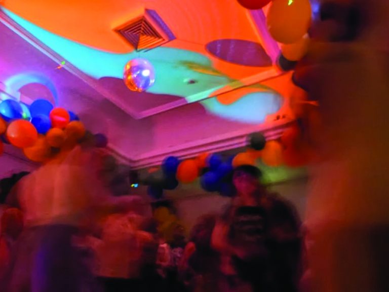 Projections and balloons on the ceiling of Dom Polski at the Remedy night