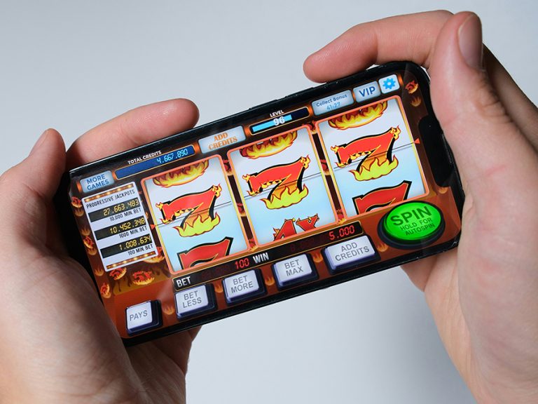 Someone is playing a mobile slot machine game Image Niek Doup Unsplash