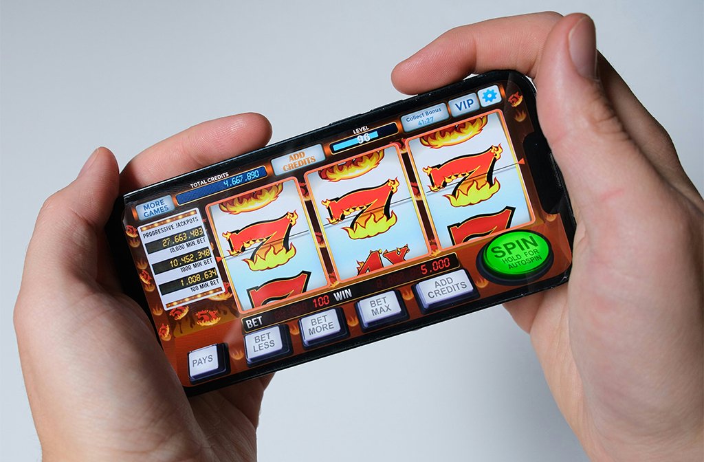 Someone is playing a mobile slot machine game Image Niek Doup Unsplash