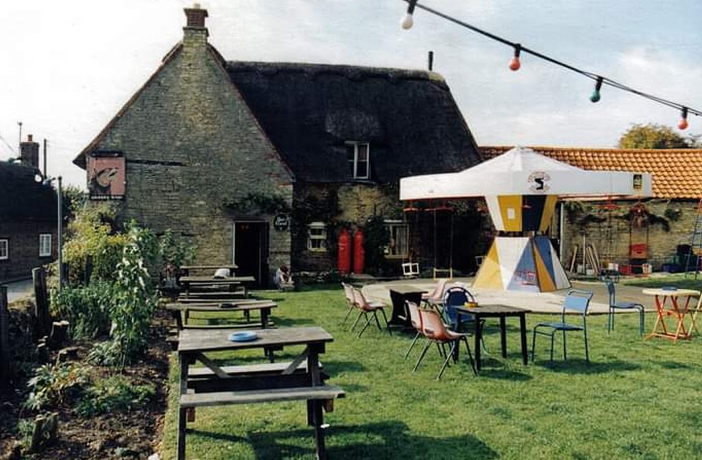 The garden of the Mad Dog in Odell, featuring a hand-operated merry go round.