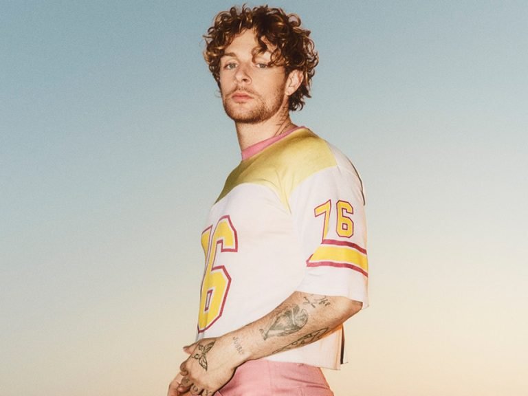 Tom Grennan pictured against a dusky sky