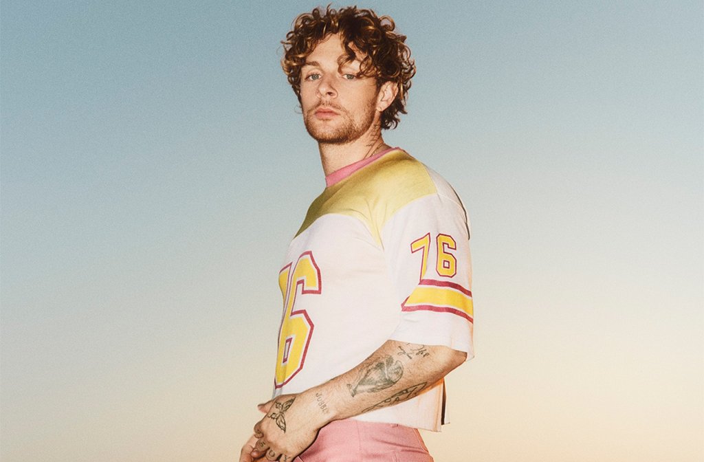Tom Grennan pictured against a dusky sky