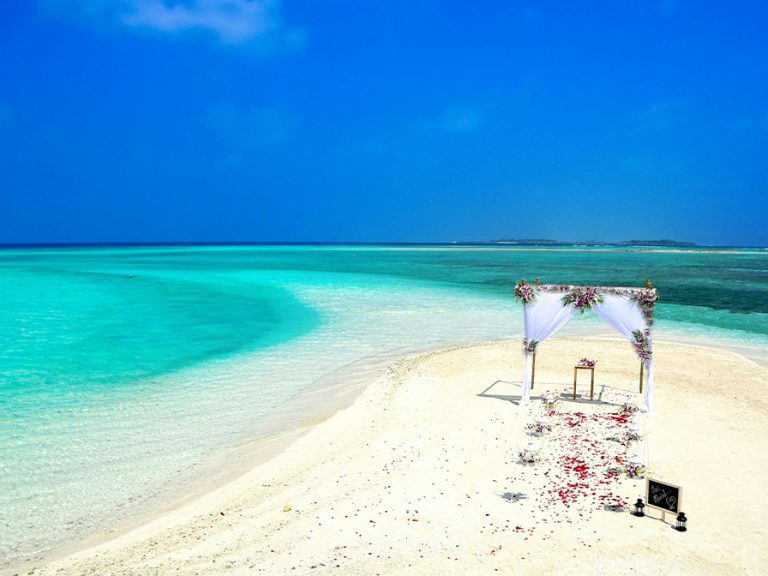 Wedding 'altar' on a tropical beach near crystal clear sea water Image Asad Photo Maldives Pexels