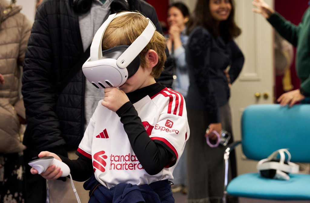 A young boy is pictured wearing a virtual reality headset at the Bedford Creative Arts' airship event