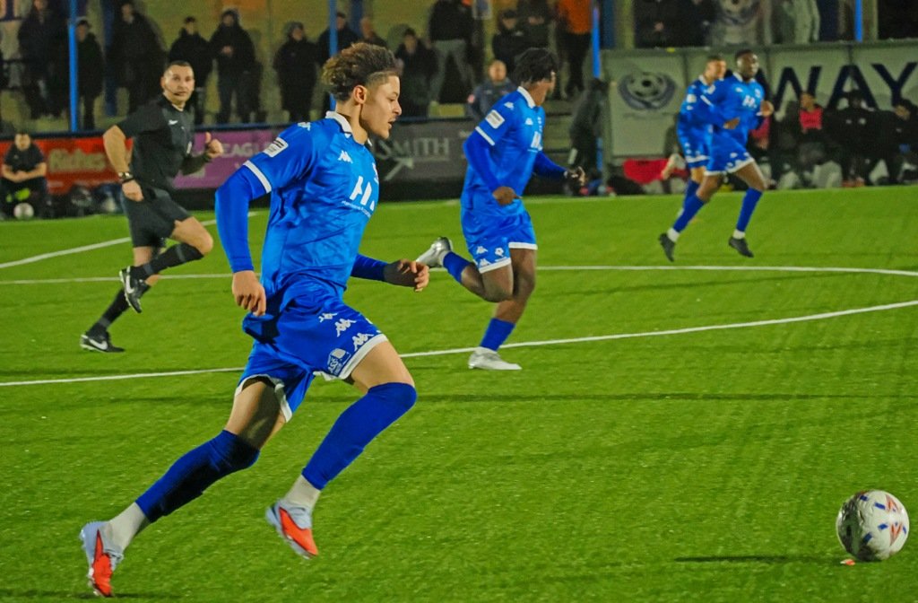Bedford Town players attack in their County Cup semi final against Biggleswade Town at The Eyrie