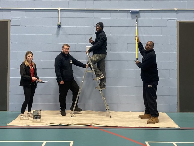 (left to right): Megan Wright, Steven Mienambolo and Carleb Mugogodi, joined by Arron Woolerson (second from left), assistant manager at Bedford International Athletic Stadium