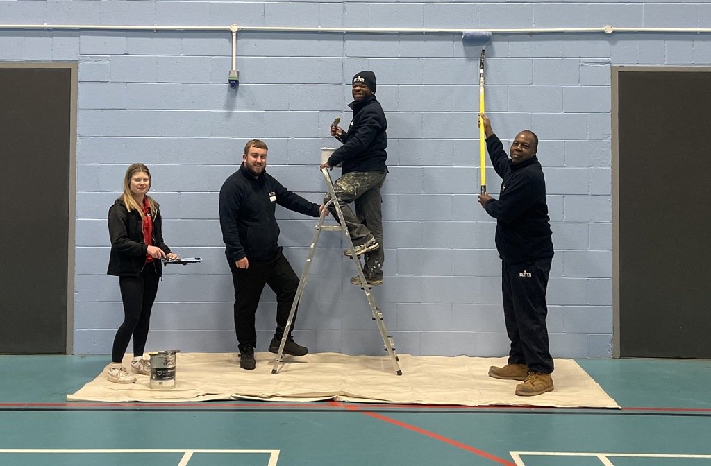 (left to right): Megan Wright, Steven Mienambolo and Carleb Mugogodi, joined by Arron Woolerson (second from left), assistant manager at Bedford International Athletic Stadium