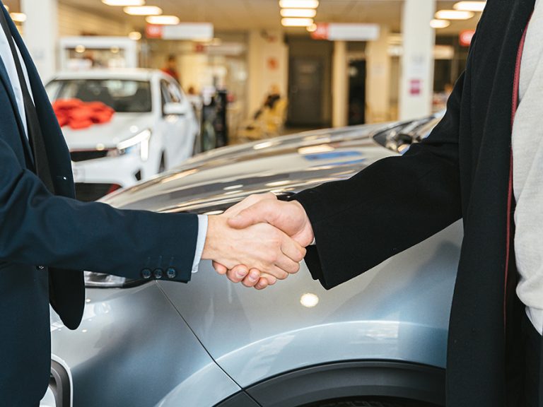 Close up of Men Shaking Hands and Cars in Background Image Antoni Shkraba Studio Pexels