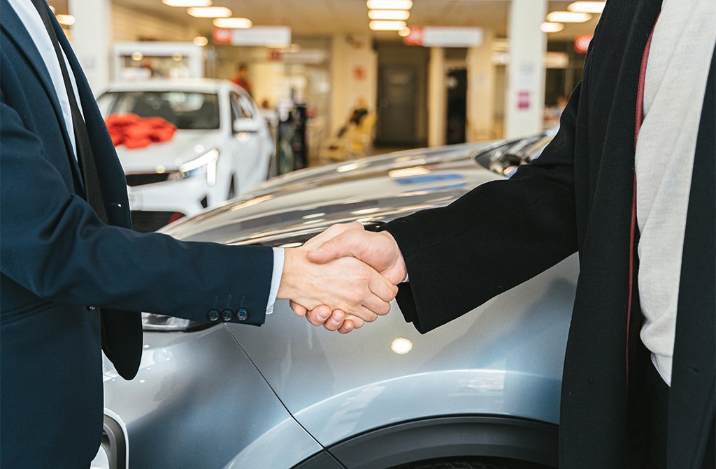 Close up of Men Shaking Hands and Cars in Background Image Antoni Shkraba Studio Pexels