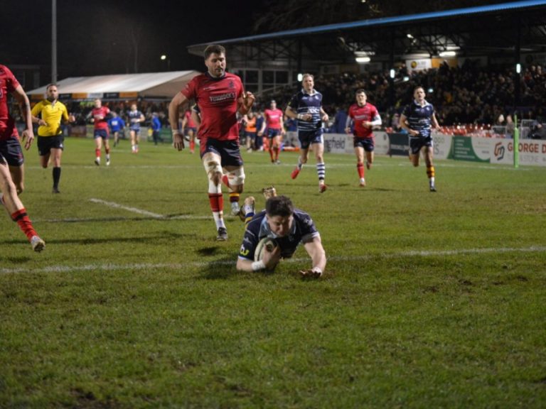 Joey Conway dives over a try against London Scottish at Goldington Road
