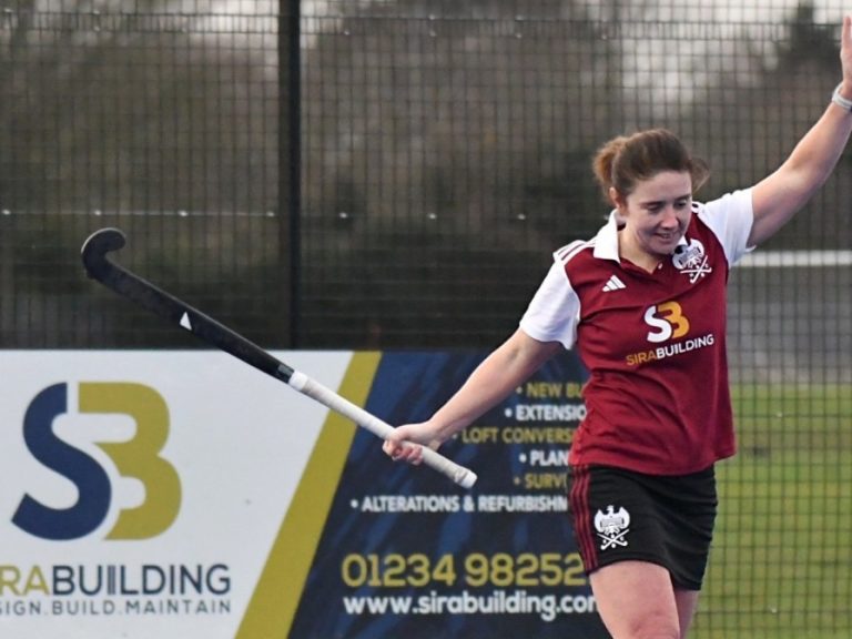 Kate Costin of Bedford Hockey Club Ladies 1st XI celebrates a goal