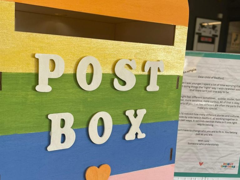 A colourful post box created by Bright Emotions CIC for their Letters to Our Children project