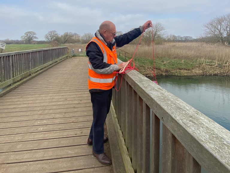 Alan Horn testing river water at Kempston. Image BedsGOVET