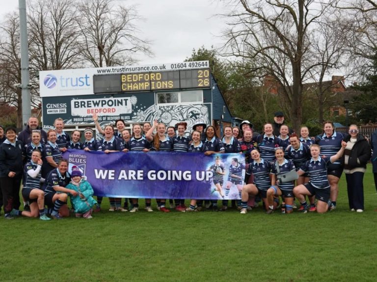 Bedford Blues Women squad and coaching staff celebrating the NC1 East title at Goldington Road