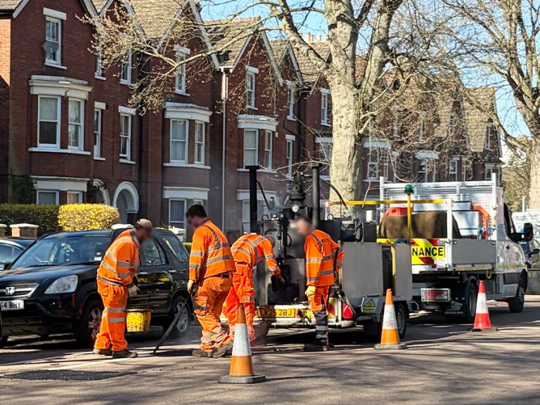 Bedford Borough Council workers filling potholes on De Parys Avenue March 2026 Image Bedford Independent