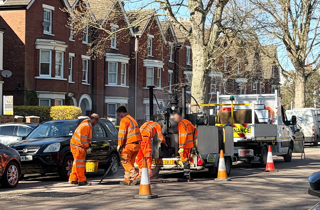 Bedford Borough Council workers filling potholes on De Parys Avenue March 2026 Image Bedford Independent