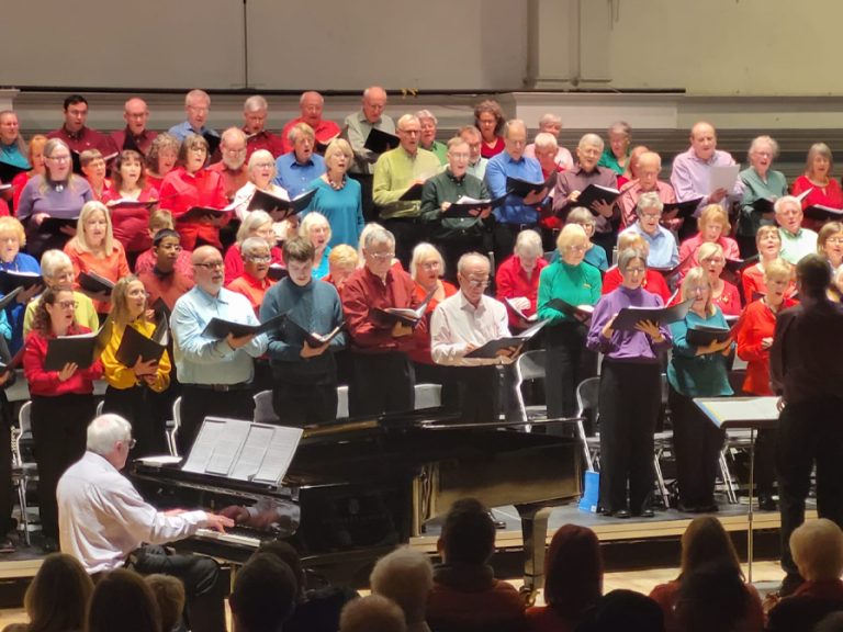 Bedford Choral Society dressed in brightly coloured outfits. Image David Longman